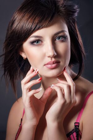 Studio portrait of beautiful young woman of the brunetteの写真素材