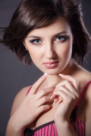 Studio portrait of beautiful young woman of the brunetteの写真素材