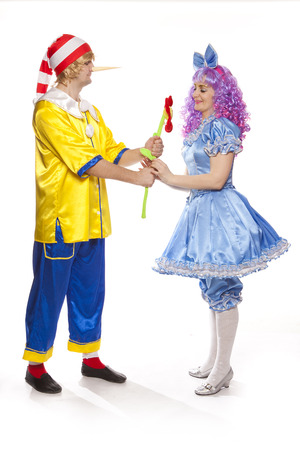 Couple of happy clowns in Pinocchio and Malvina suits  Isolated on whiteの写真素材