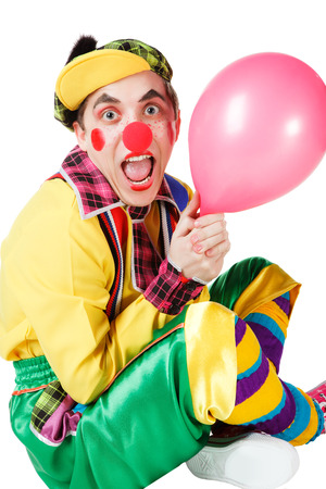 clown with a balloon in a hand isolated on a white backgroundの写真素材