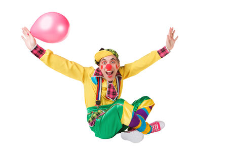 clown with a balloon in a hand isolated on a white backgroundの写真素材