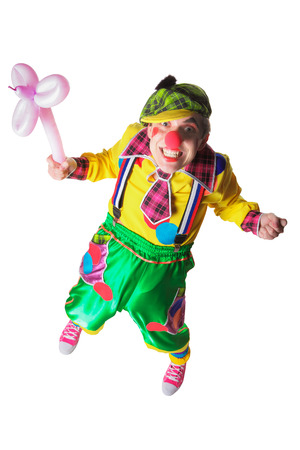 Funny clown with a flower from a balloon isolated on white backgroundの写真素材