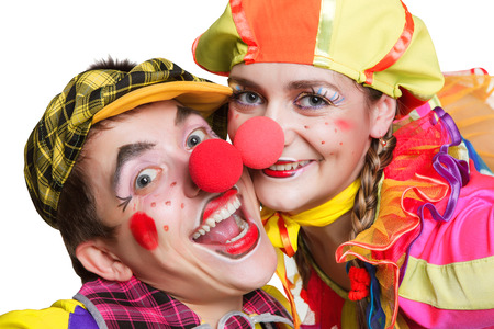 Two smiling clowns isolated over a white backgroundの写真素材