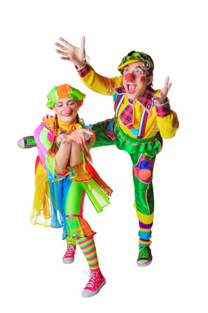 Two cheerful clowns in the soap bubbles isolated on a white backgroundの写真素材
