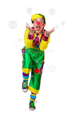 Cheerful clown in the soap bubbles isolated on a white backgroundの写真素材