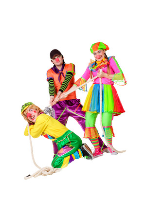 Three smiling clowns isolated over a white backgroundの写真素材
