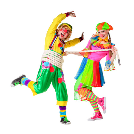 Two smiling clowns isolated over a white backgroundの写真素材