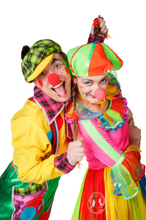 Two clown smiling isolated over a white backgroundの写真素材
