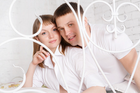 Pregnant woman with her husband at homeの写真素材