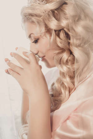 portrait of the bride with a cup of coffeeの写真素材