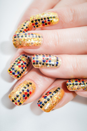 Female hands with nails art on the white backgroundの写真素材