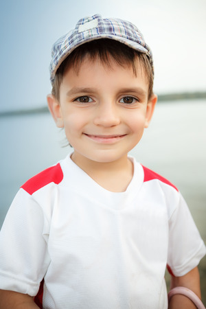 Photo of adorable young happy boy looking at cameraの写真素材