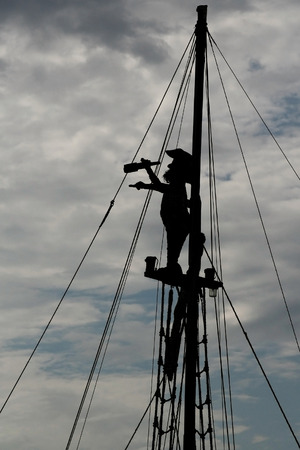 silhouette of a pirate on the match looking through spyglass   not an actual pirate , imitation  の写真素材