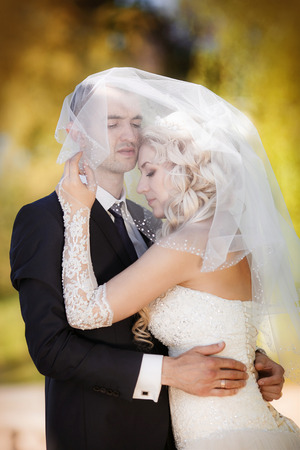 Happy bride and groom on their weddingの写真素材