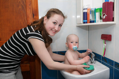 Sweet child taking a bath の写真素材