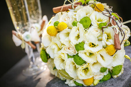 Wedding bridal bouquet and champagne glassesの写真素材