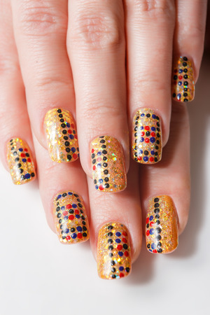 Female hands with nails art on the white backgroundの写真素材