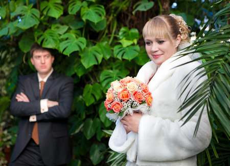 Beautiful just married couple walking on path at junglesの写真素材