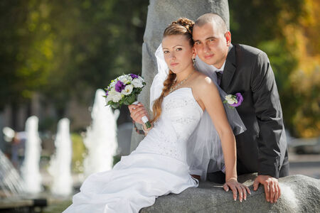 groom and  bride near the fountainの写真素材
