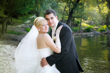 Happy bride and groom on the beachの写真素材