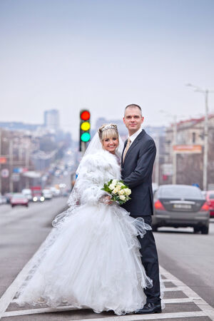 groom and bride during walk in the cityの写真素材