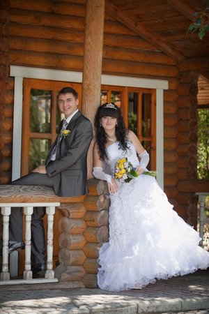 groom and the bride in park in their wedding dayの写真素材