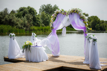 Beautiful wedding arch on the beachの写真素材