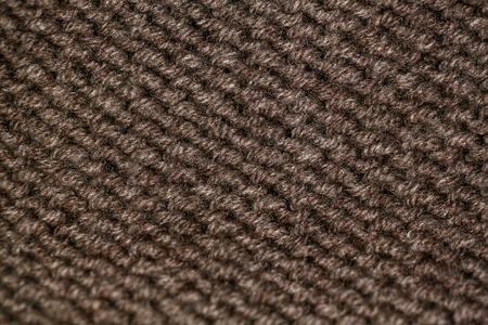 Knitting pattern from beige ore brown woolen warm soft yarn for backgroundの写真素材