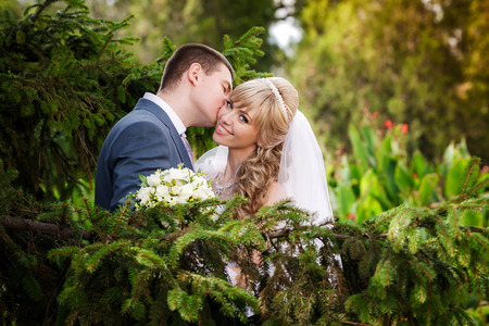 Happy bride and groom on their wedding dayの写真素材