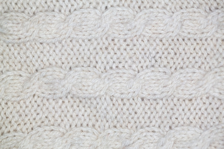 Knitting pattern from gray woolen warm soft yarn for backgroundの写真素材