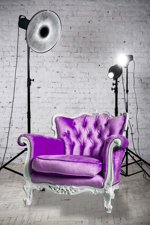 Photographic studio with equipment, accessories and violet armchairの写真素材