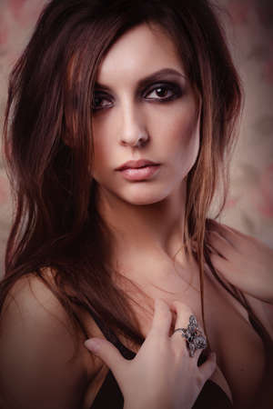 Portrait of pretty young woman in the studioの写真素材