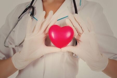 The doctor shows heart isolated on a white backgroundの写真素材