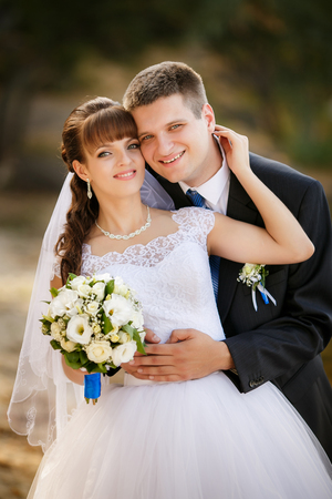 Happy bride and groom on their weddingの写真素材