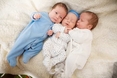 Portrait of newborn triplets - boys close upの写真素材