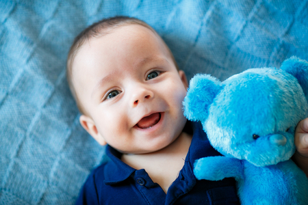 Portrait of newborn baby is lying on the blanketの写真素材