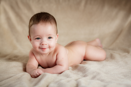 Portrait of newborn baby is lying on the blanketの写真素材