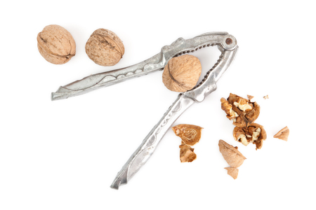 Nutcracker and walnuts isolated on a white backgroundの写真素材