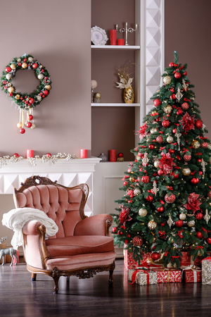Image of chimney and decorated Christmas tree with giftの写真素材
