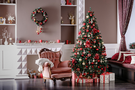 Image of chimney and decorated Christmas tree with giftの写真素材