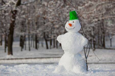 Fun snowman in park.の写真素材