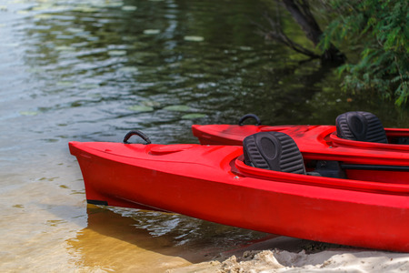 Two red kayaks on the beach.の写真素材