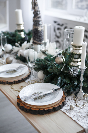 Table served for Christmas dinner in living room, close up viewの写真素材