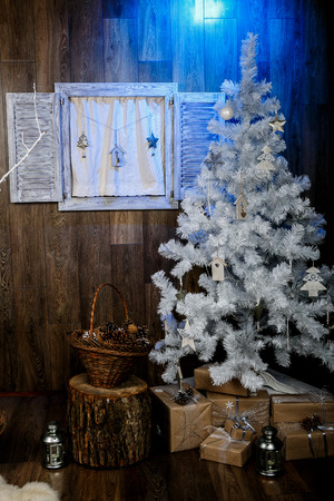Winter background.Merry Christmas and happy New Year greeting card.Christmas tree with  decorations  and blue lightの写真素材