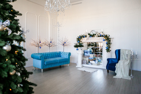 Image of chimney and decorated Christmas tree with giftの写真素材