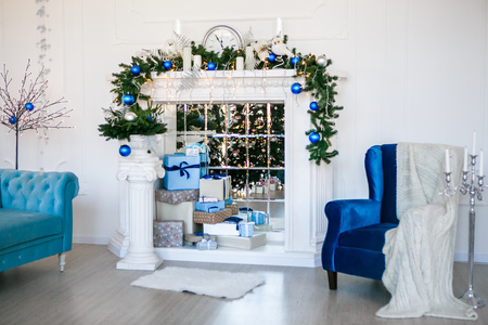 Image of chimney and decorated Christmas tree with giftの写真素材