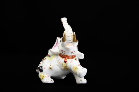 porcelain elephant on a black backgroundの写真素材