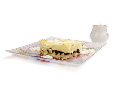 baked potato pudding  on a plate isolated on whiteの写真素材
