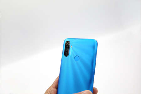 Bangkok, Thailand - FEBRUARY 24, 2020 - Realme - Realme C3 Smartphone New Brand Of Realme for Editorial. Hand Holding with White Background.のeditorial素材