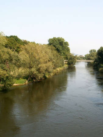 Landscape with the bridge on river in Regensburgの写真素材